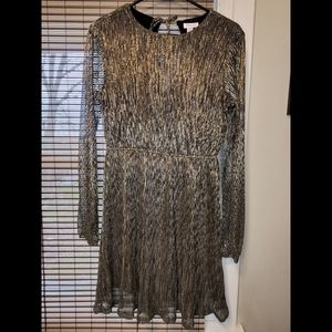 Brand new Xhilaration party dress in gilver! Never worn. Size Small.